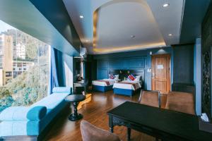 a living room with a couch and a table at Sapa Charm Hotel in Sapa