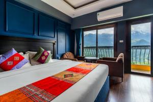 a bedroom with a bed with a view of the ocean at Sapa Charm Hotel in Sapa
