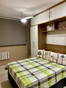 Ένα ή περισσότερα κρεβάτια σε δωμάτιο στο Apartamento proximo ao Rio centro parque olimpico golf club e praias +39 φωτογραφίες