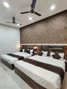 Voodi või voodid majutusasutuse Hotel GS Grand Amritsar toas