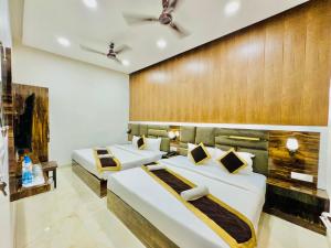 Voodi või voodid majutusasutuse Hotel GS Grand Amritsar toas