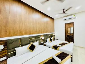 Voodi või voodid majutusasutuse Hotel GS Grand Amritsar toas