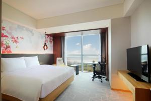 Postel nebo postele na pokoji v ubytování Hilton Garden Inn Zhuhai Hengqin