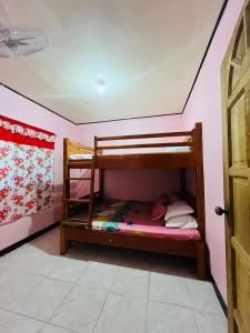 Voodi või voodid majutusasutuse Precys Transient House toas +1 foto