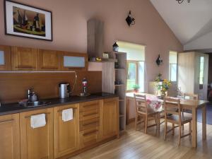 a kitchen with a table and a dining room at Cozy Corner in Saulkrasti