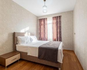 Postel nebo postele na pokoji v ubytování ELİT SUİT