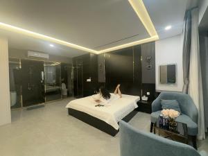 a woman laying on a bed in a hotel room at Eden Hotel in Ho Chi Minh City