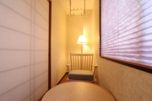 Postel nebo postele na pokoji v ubytování 華宿301駅一分全新設備