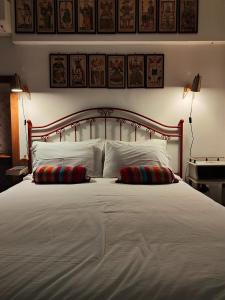 a large white bed with two pillows on it at Le Piracante in Caiazzo