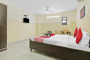 Ένα ή περισσότερα κρεβάτια σε δωμάτιο στο Super Hotel O Royal Green