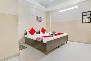 Ένα ή περισσότερα κρεβάτια σε δωμάτιο στο Super Hotel O Royal Green +19 φωτογραφίες