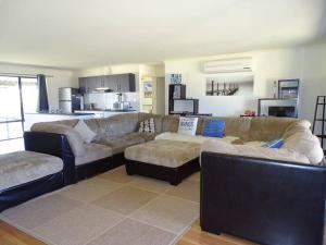 a living room with two couches and a couch at Baydream in Port Moonta