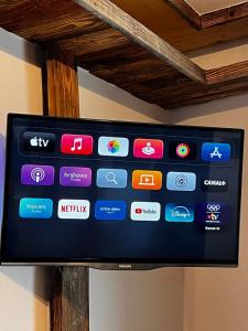 a television screen with a bunch of different apps at Appartement les Sapineaux in Courchevel