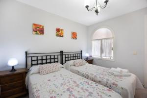 En eller flere senge i et værelse på Apartamento Arrecife D + 17 billeder