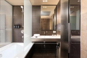 a bathroom with a sink and a mirror at B Hotel in Barcelona +41 photos