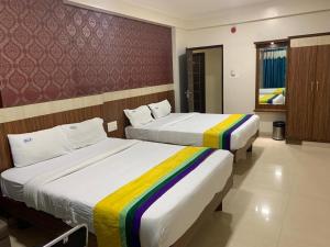 Letto o letti in una camera di Hotel BCP Suites