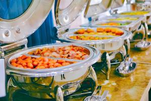 three trays of food sitting on a table at Tuyet Son Hotel (TS Ocean Hotel) in Da Nang