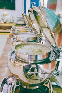 a row of drums are lined up on a counter at Tuyet Son Hotel (TS Ocean Hotel) in Da Nang