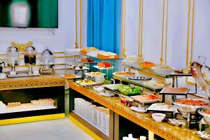 a buffet line with many different types of food at Tuyet Son Hotel (TS Ocean Hotel) in Da Nang