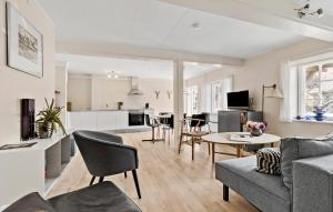 a living room with a couch and a table at 2 Bedroom Awesome Apartment In Svaneke in Svaneke