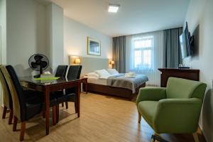 Postel nebo postele na pokoji v ubytování Hotel Volf