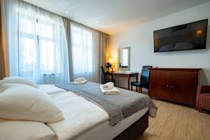 Postel nebo postele na pokoji v ubytování Hotel Volf