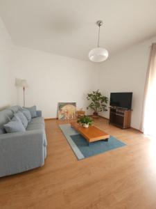 a living room with a couch and a coffee table at La Liva in San Silvestro