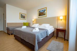 Postel nebo postele na pokoji v ubytování Hotel Volf