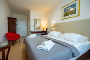 Postel nebo postele na pokoji v ubytování Hotel Volf