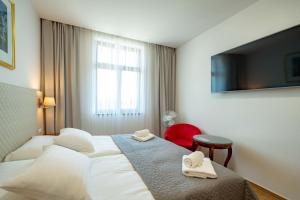 Postel nebo postele na pokoji v ubytování Hotel Volf