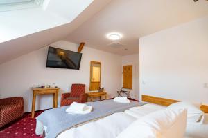 Postel nebo postele na pokoji v ubytování Hotel Volf
