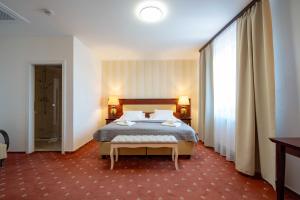 Postel nebo postele na pokoji v ubytování Hotel Volf