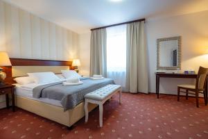 Postel nebo postele na pokoji v ubytování Hotel Volf
