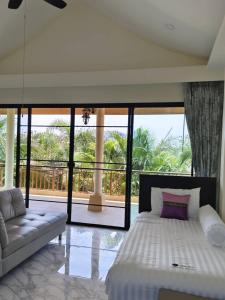 Katil atau katil-katil dalam bilik di Aurora Resort