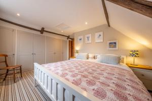 a bedroom with a large bed in a room at Gable End in Great Snoring +42 photos