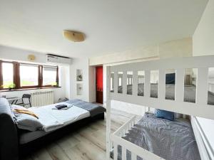 a bedroom with two bunk beds and a desk at Central Apartments' Privat-Sauna free Parking AmurResidence FamilyConcept in Iaşi