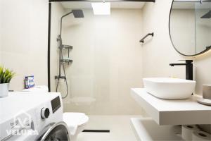 a white bathroom with a toilet and a sink at Veluxa - Renovated! La Maison des Artist in Dubai