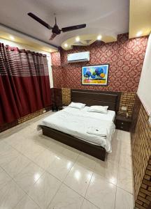 Postel nebo postele na pokoji v ubytování Hotel Ace