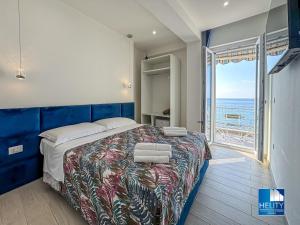 a bedroom with a bed with a view of the ocean at [Tropea]Luxury Terrace Sea Suite in Tropea