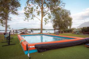 a large swimming pool with an inflatable at Ośrodek Wypoczynkowy "Marina Rozbejko" in Myślibórz