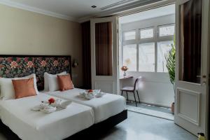 Postel nebo postele na pokoji v ubytování King Charles Hotel + 37 fotografií