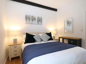 Voodi või voodid majutusasutuse Calvin's Cottage toas