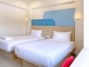 Postel nebo postele na pokoji v ubytování HOP INN Krabi Building A