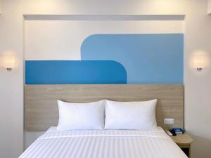 Postel nebo postele na pokoji v ubytování HOP INN Krabi Building A