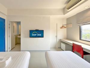 Postel nebo postele na pokoji v ubytování HOP INN Krabi Building A