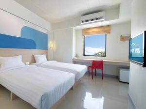 Postel nebo postele na pokoji v ubytování HOP INN Krabi Building A