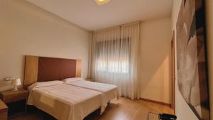 Postel nebo postele na pokoji v ubytování Hotel-Apartamentos Tartesos