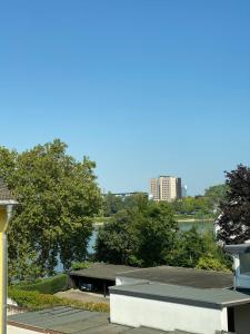 a building with a view of a river and a city at Koblenz - eigenes Bad,Küche - Wifi - Parkplatz - 2 OG in Koblenz +6 photos