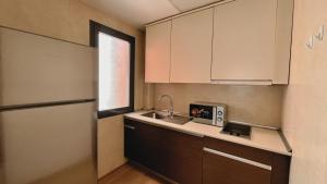 Kuchyň nebo kuchyňský kout v ubytování Hotel-Apartamentos Tartesos
