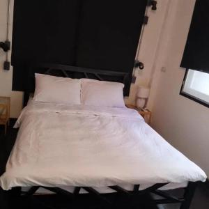 Dreamcatcher Bangkok客房内的一张或多张床位